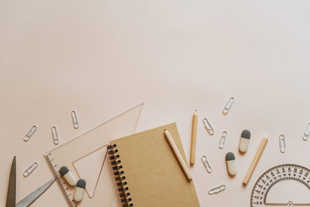 Spiral Notebook Pencils and Paper Clips Flatlay